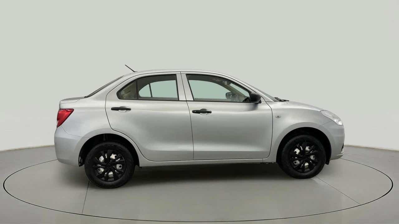 Side view of a Splendid Silver Maruti Suzuki Dzire 2018-2023