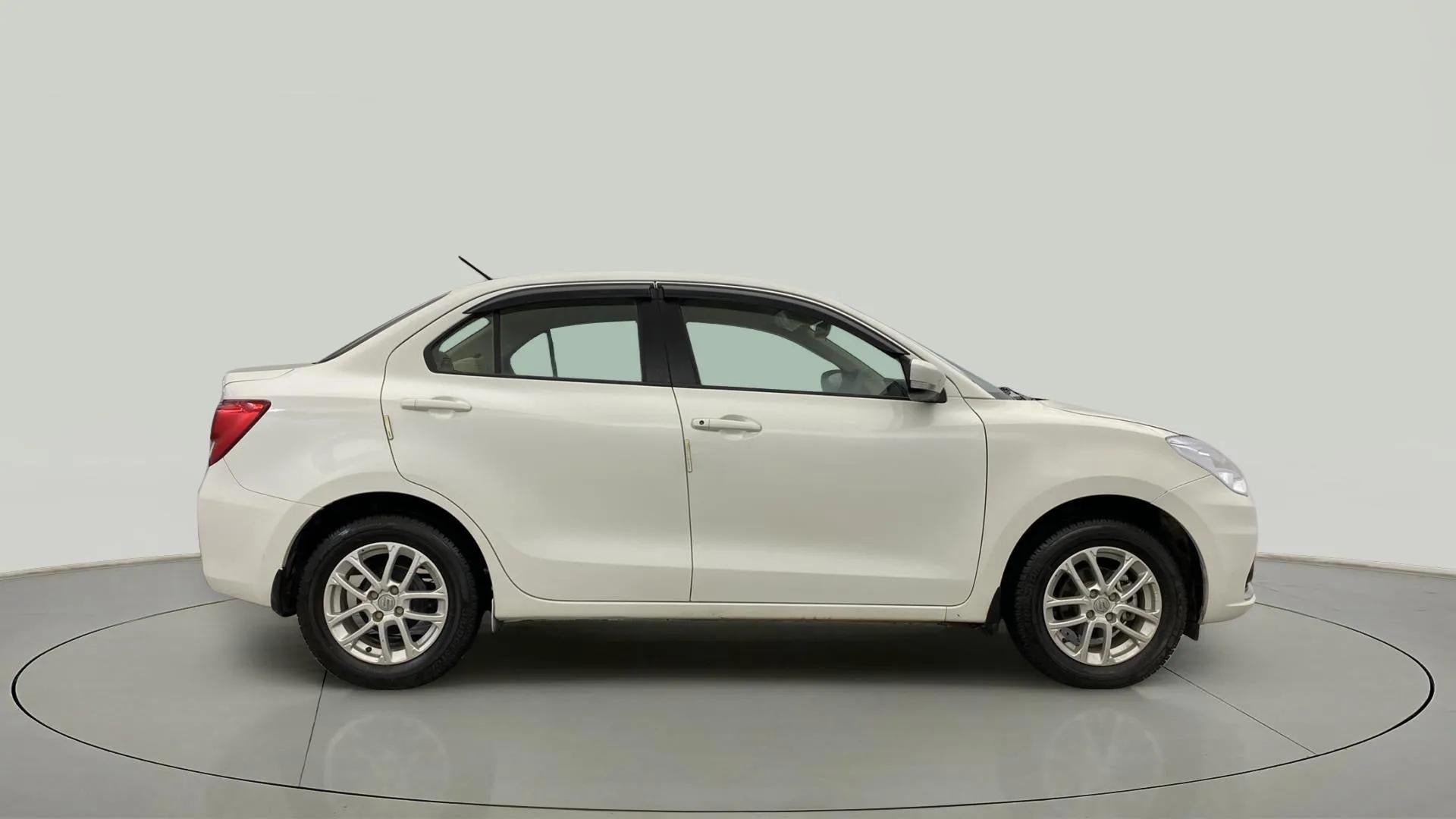 Side view of a Pearl Arctic White Maruti Suzuki Dzire