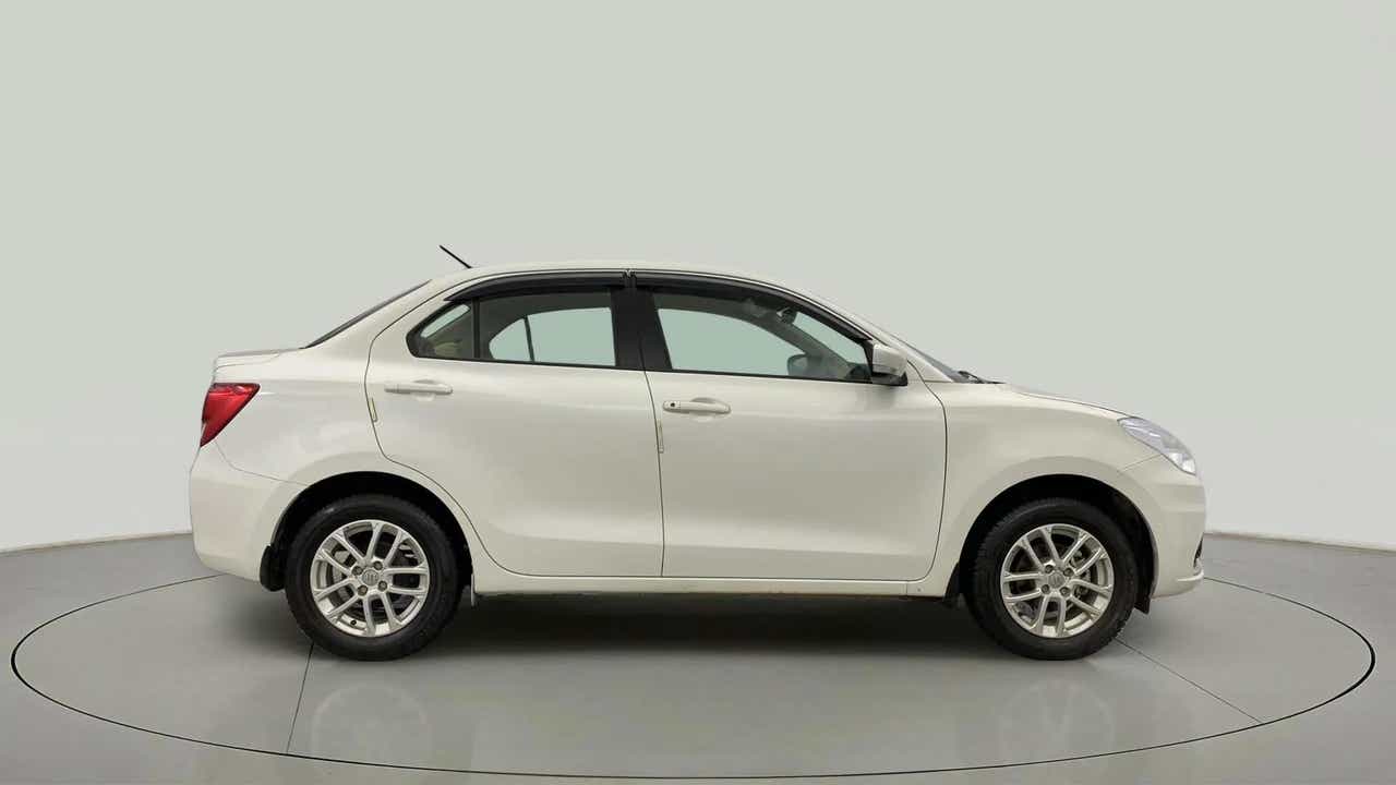 Side view of a Pearl Arctic White Maruti Suzuki Dzire
