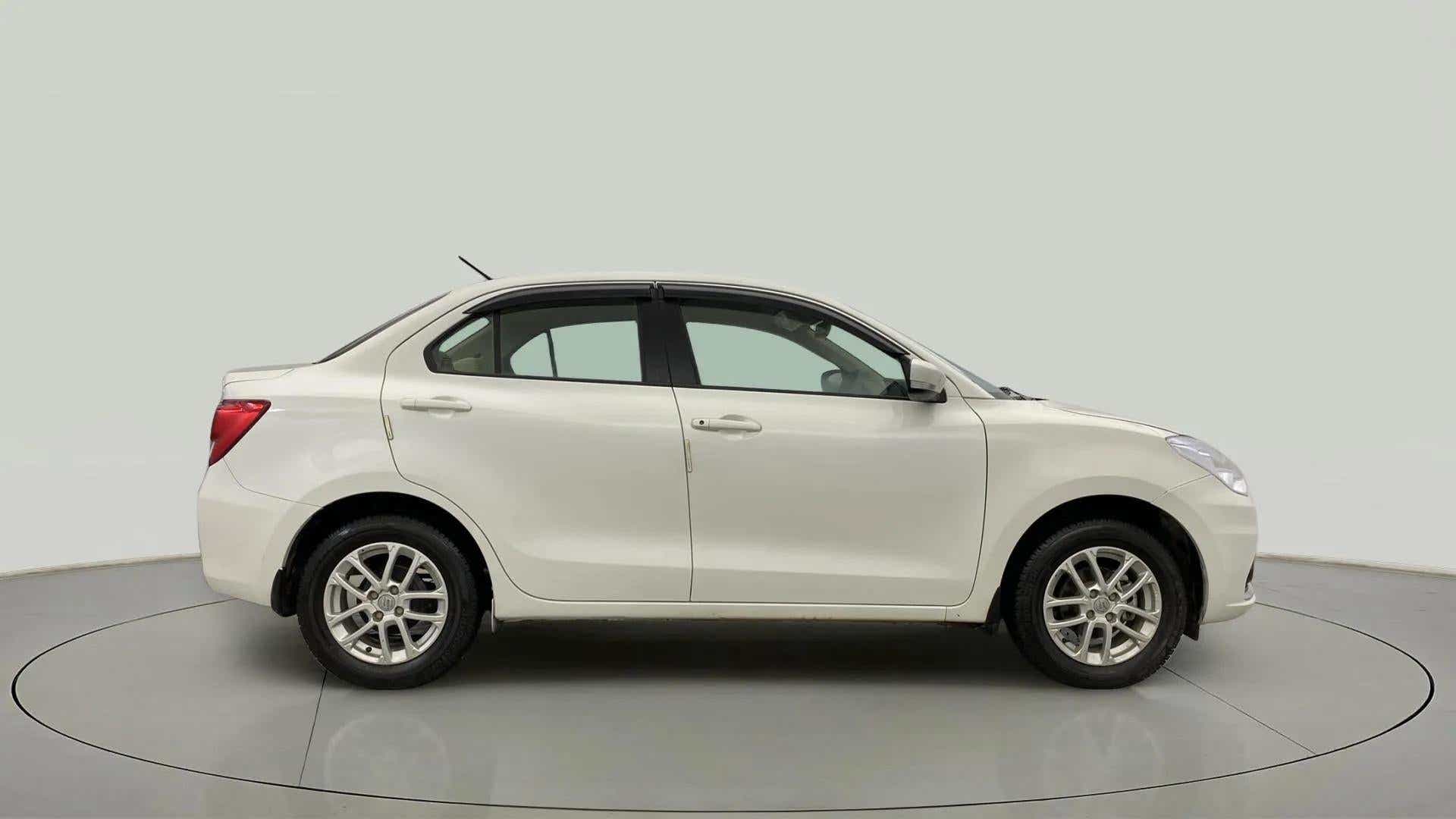 Side view of a Pearl Arctic White Maruti Suzuki Dzire