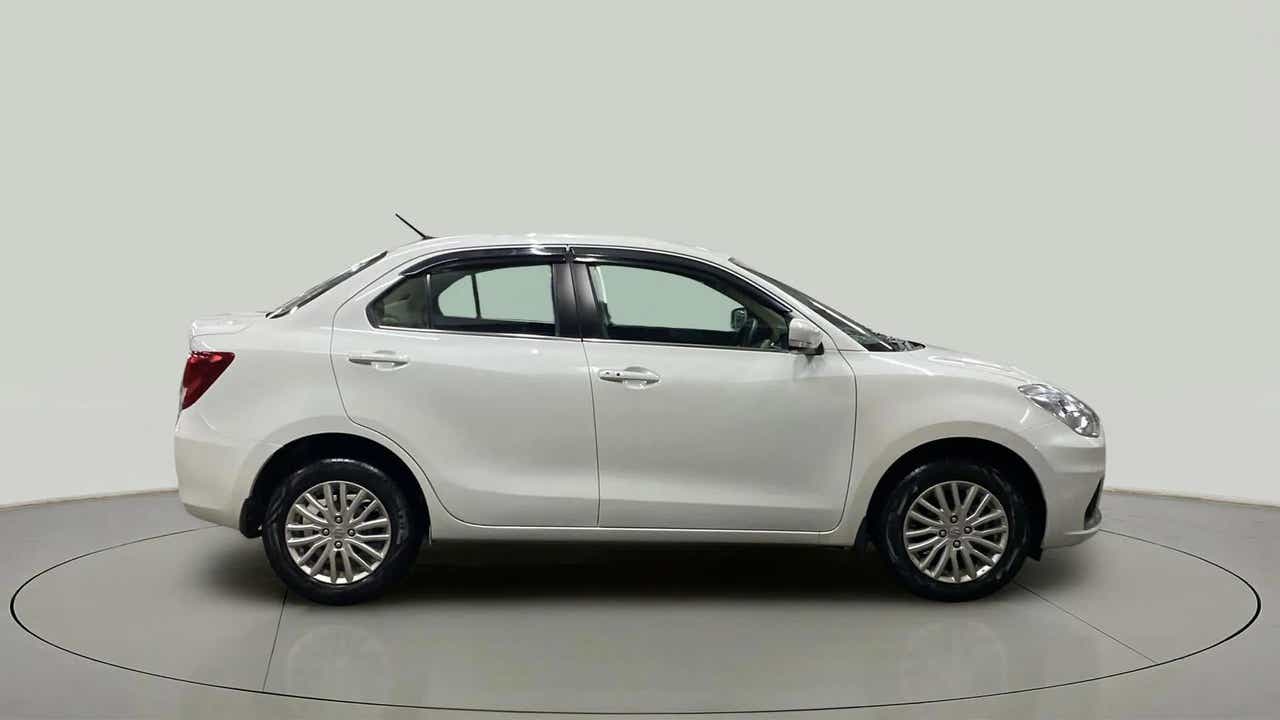 Side view of a Arctic White Maruti Suzuki Dzire 2018-2023