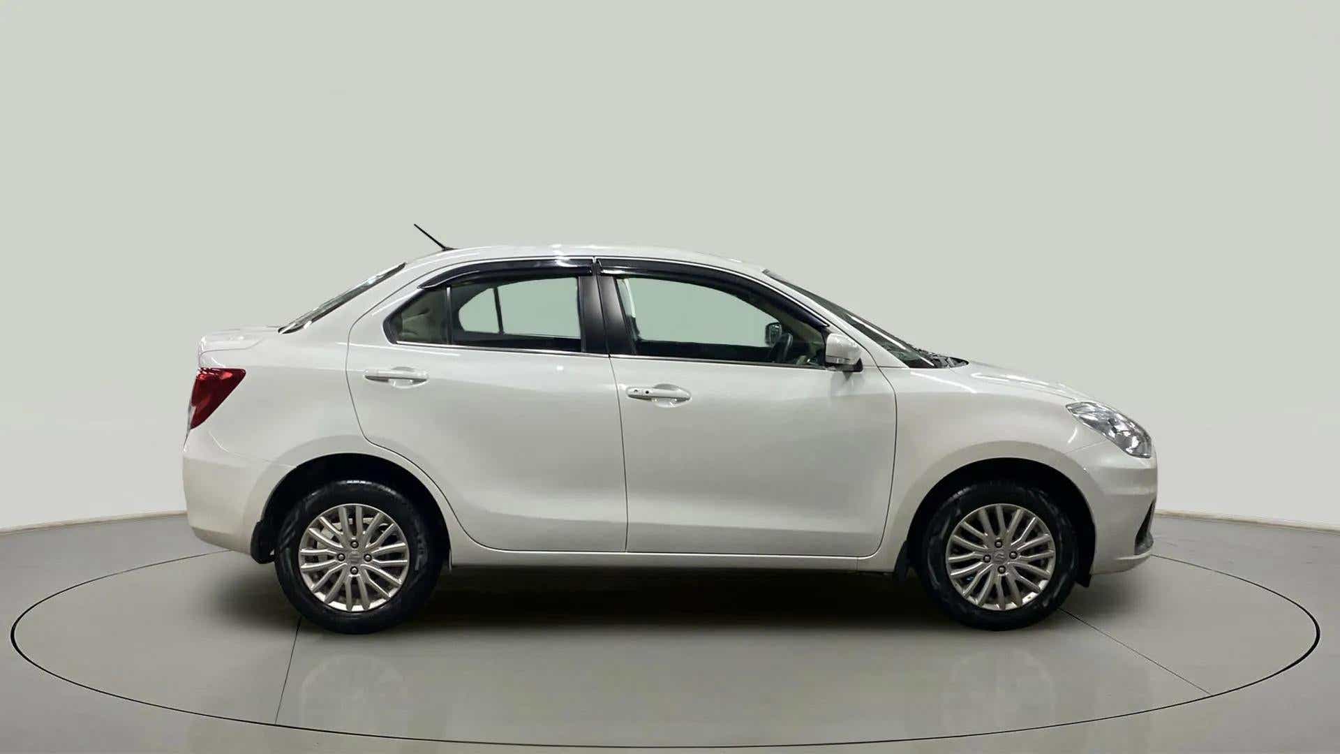 Side view of a Arctic White Maruti Suzuki Dzire 2018-2023