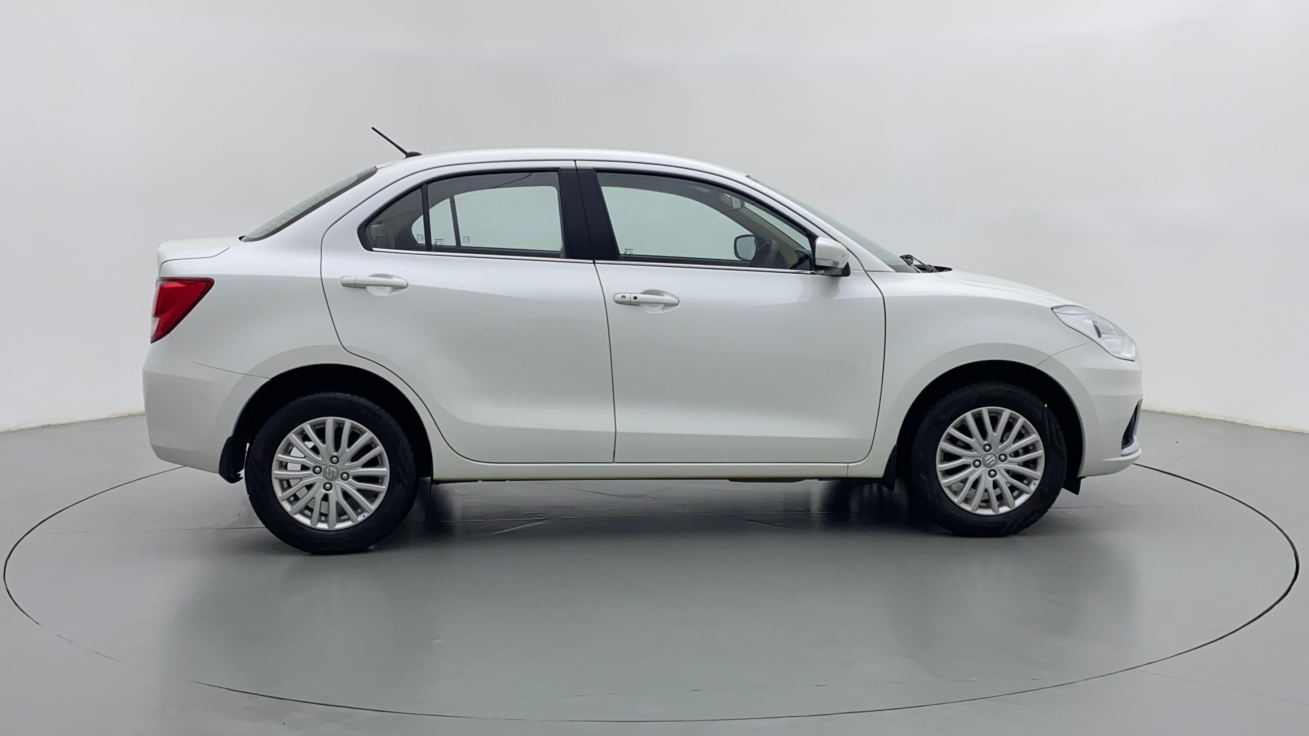 Side view of a arctic white Maruti Suzuki Dzire 2018-2023