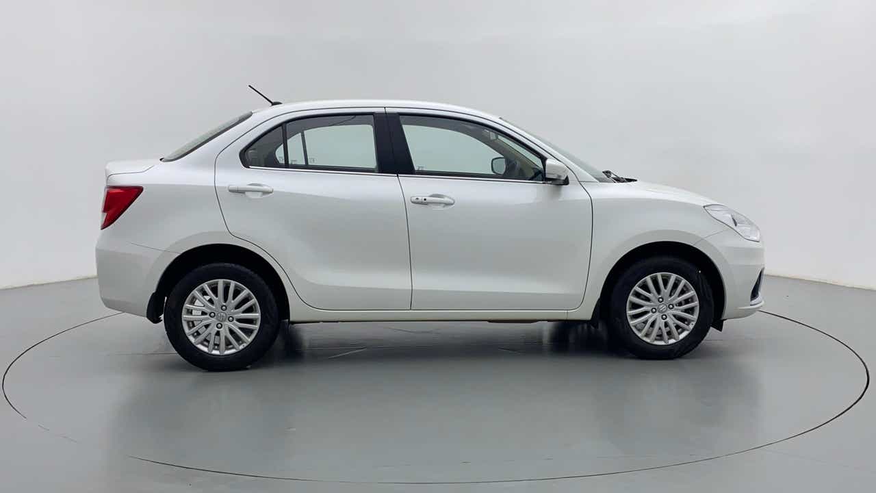 Side view of a arctic white Maruti Suzuki Dzire 2018-2023