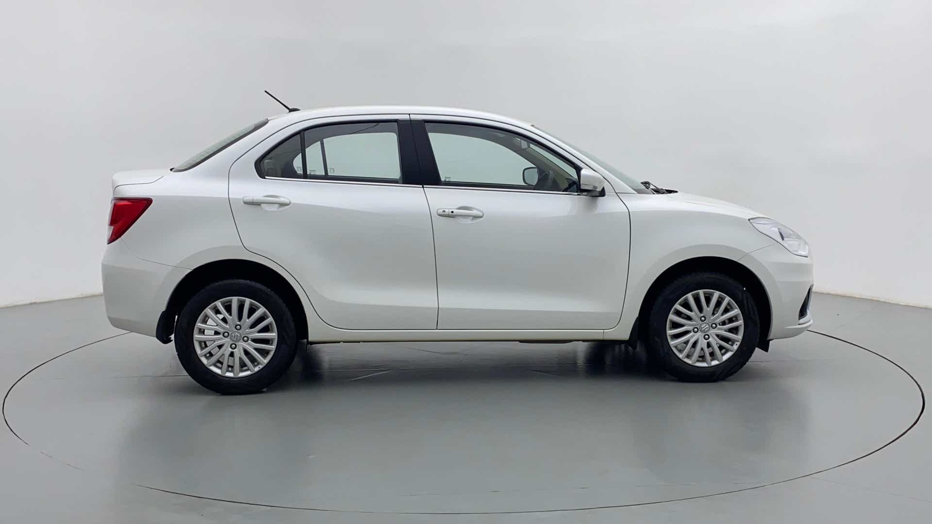 Side view of a arctic white Maruti Suzuki Dzire 2018-2023