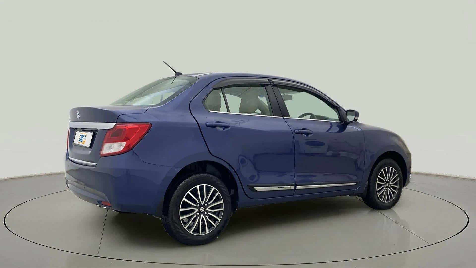 Rear three-quarter of a Alluring Blue Maruti Suzuki Dzire