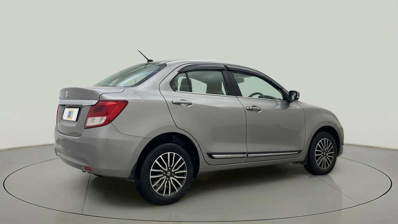 Rear three-quarter view of a splendid silver Maruti Suzuki Dzire 2018-2023