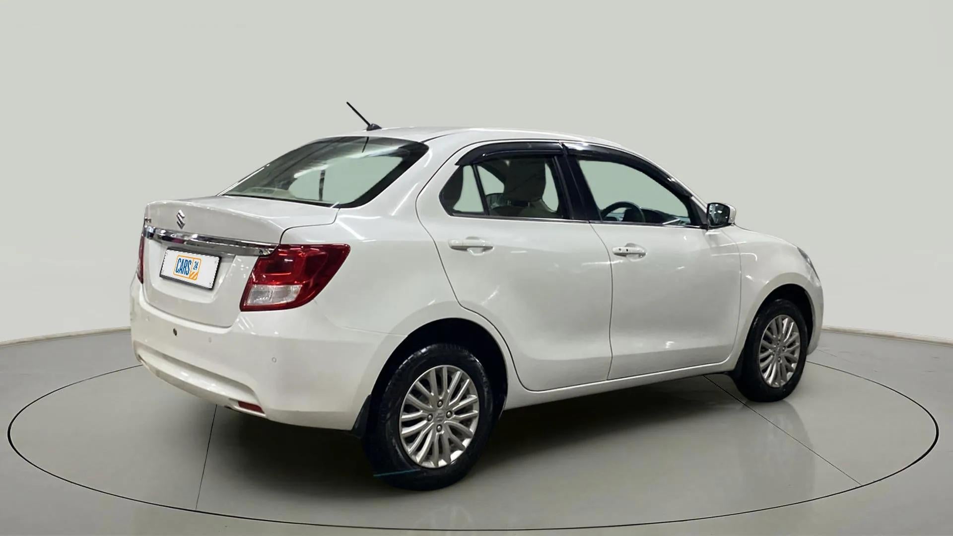 Rear three-quarter view of a Arctic White Maruti Suzuki Dzire 2018-2023