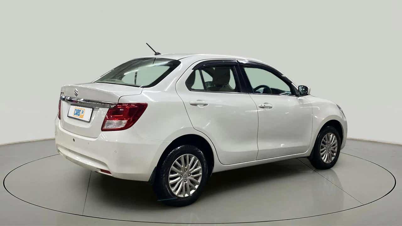 Rear three-quarter view of a Arctic White Maruti Suzuki Dzire 2018-2023
