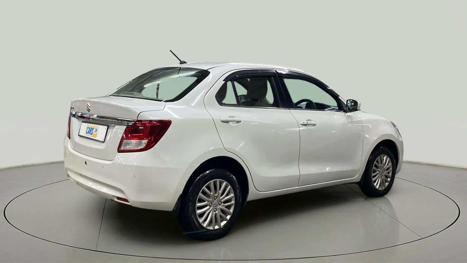 Rear three-quarter view of a Arctic White Maruti Suzuki Dzire 2018-2023