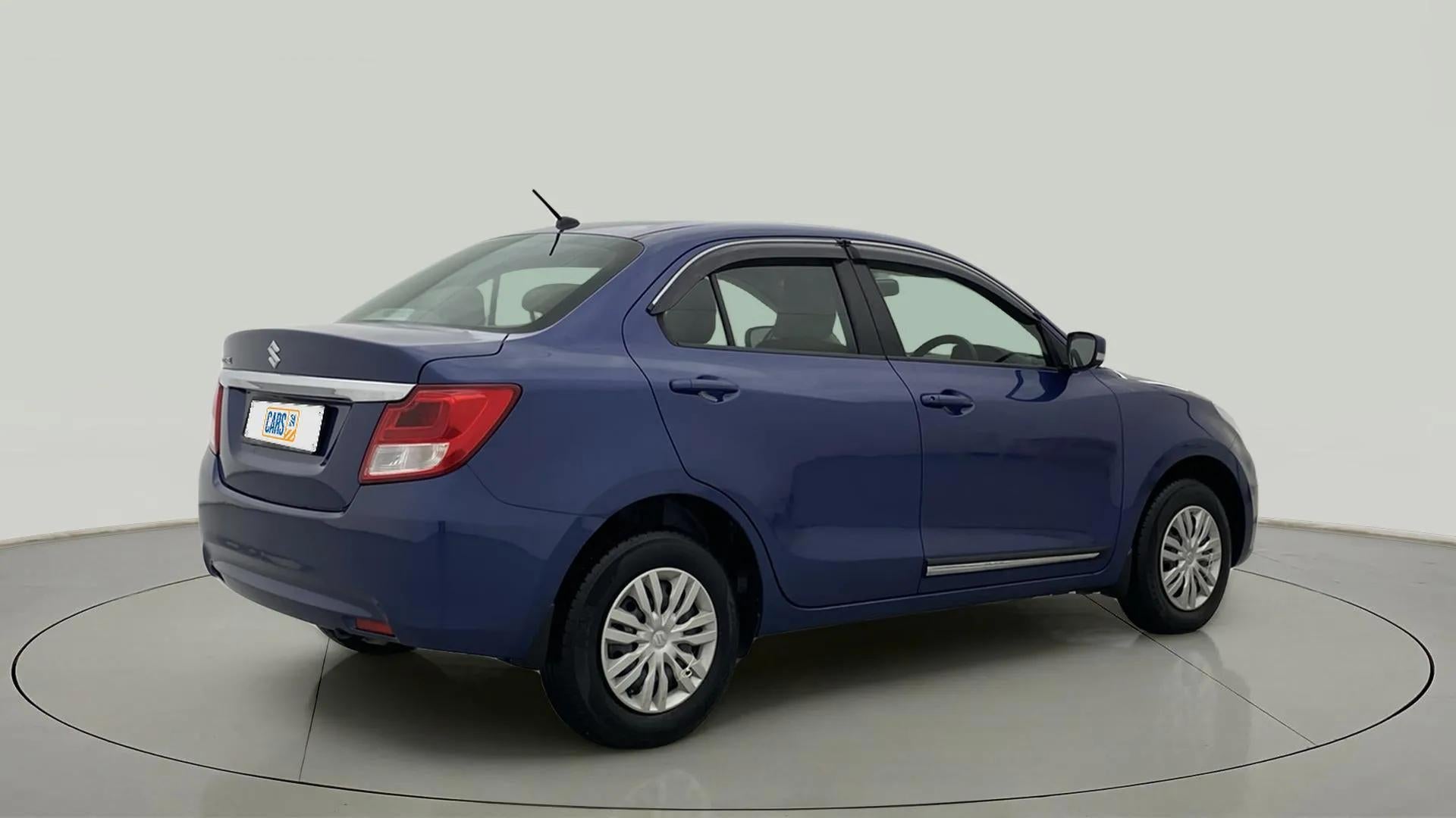 Rear three-quarter of a oxford blue Maruti Suzuki Dzire 2018-2023