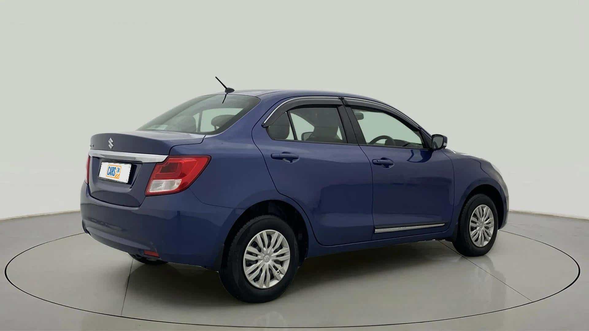 Rear three-quarter of a oxford blue Maruti Suzuki Dzire 2018-2023