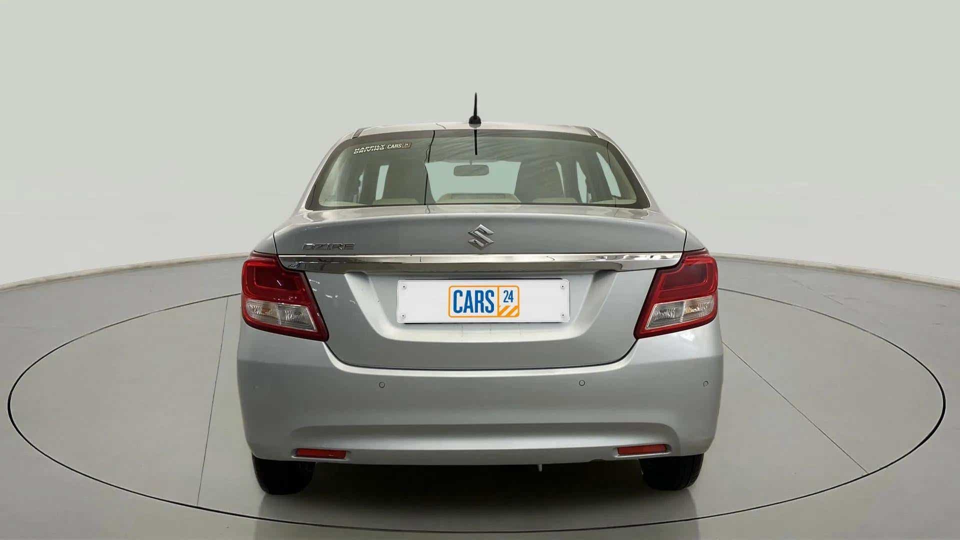 Rear view of a splendid silver Maruti Suzuki Dzire 2018-2023