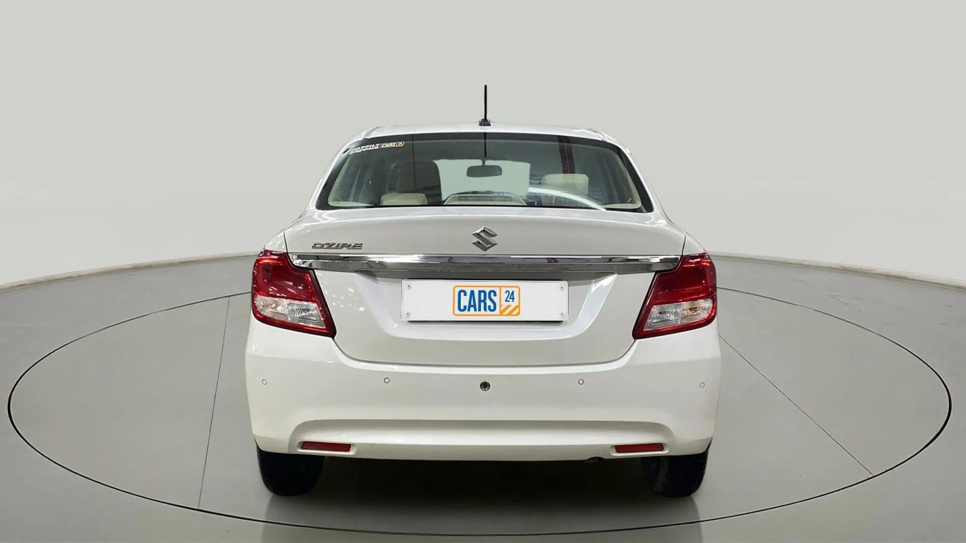 Rear view of a Arctic White Maruti Suzuki Dzire 2018-2023