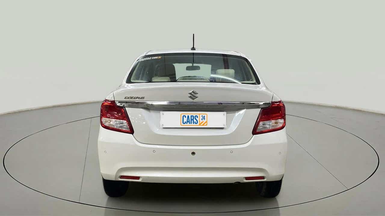 Rear view of a Arctic White Maruti Suzuki Dzire 2018-2023