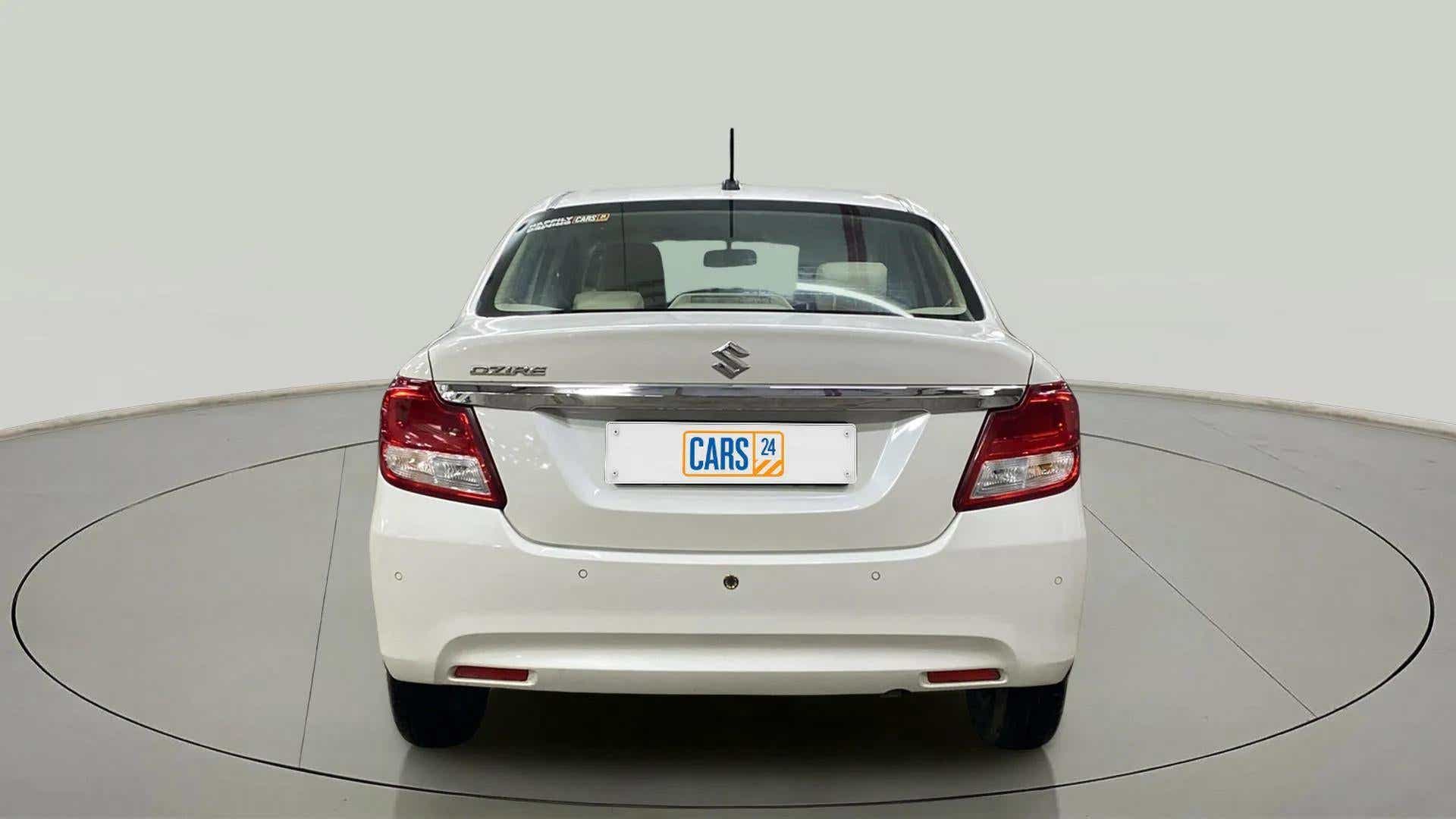 Rear view of a Arctic White Maruti Suzuki Dzire 2018-2023
