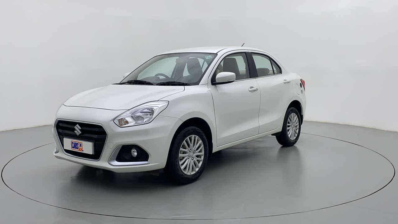 Front three-quarter view of a arctic white Maruti Suzuki Dzire 2018-2023