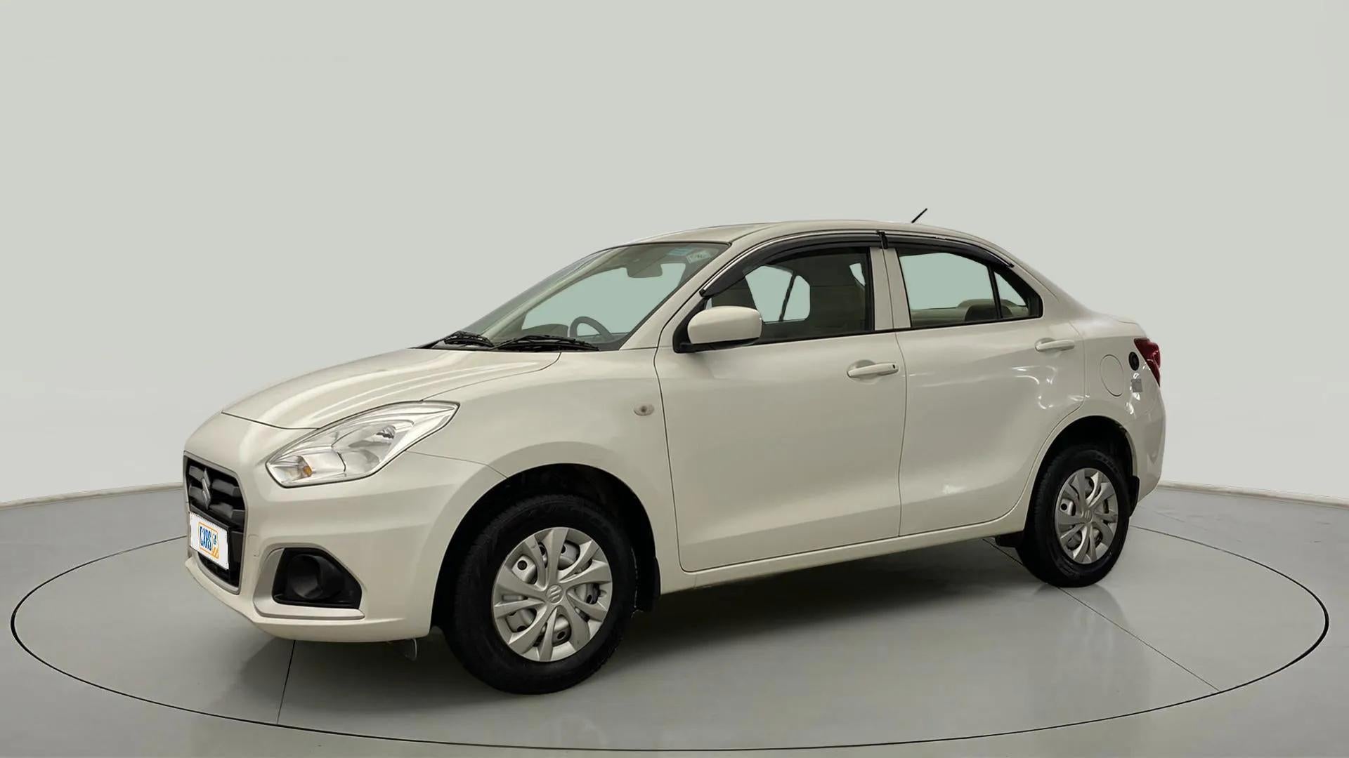 Front side view of a Pearl Arctic White Maruti Suzuki Dzire