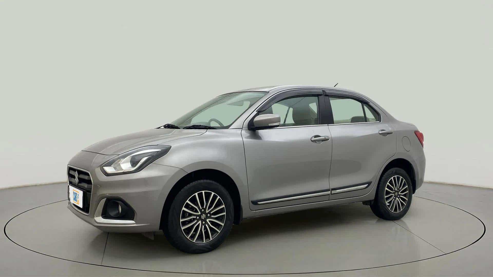 Front side view of a splendid silver Maruti Suzuki Dzire 2018-2023