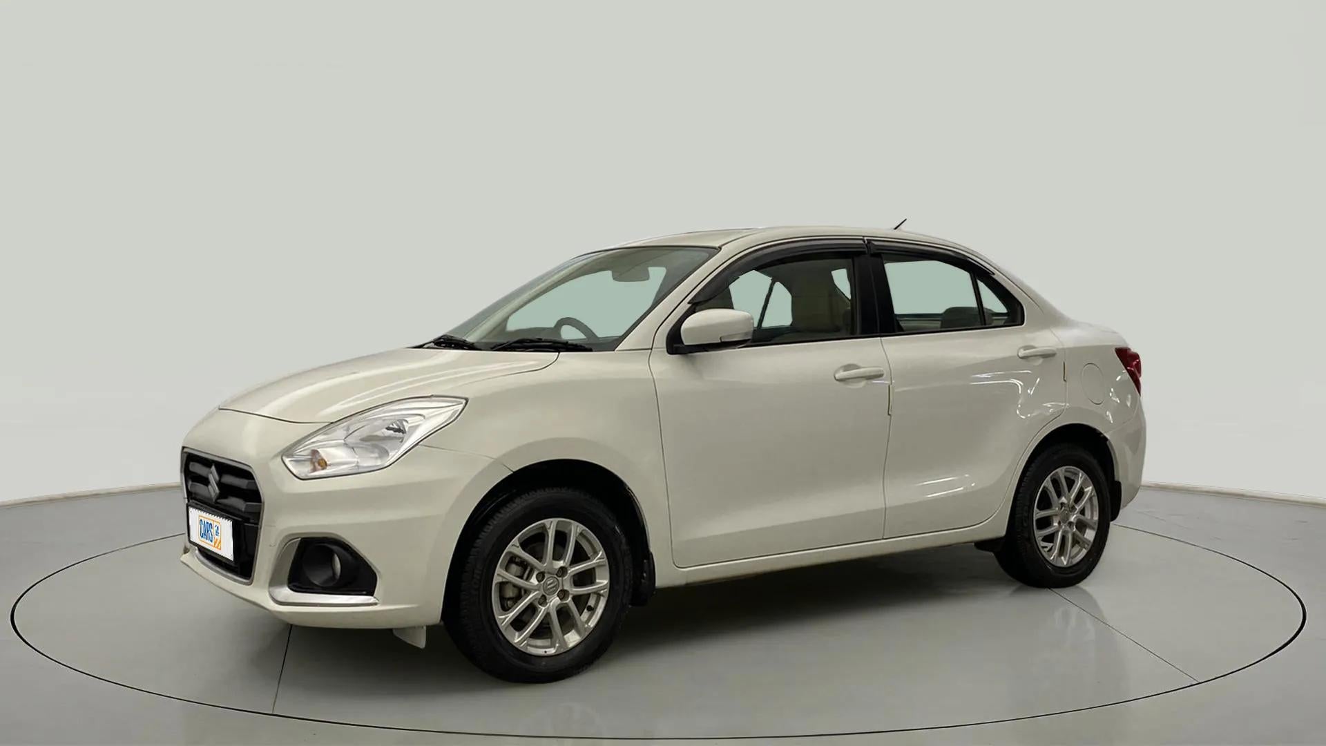 Front three-quarter view of a Pearl Arctic White Maruti Suzuki Dzire