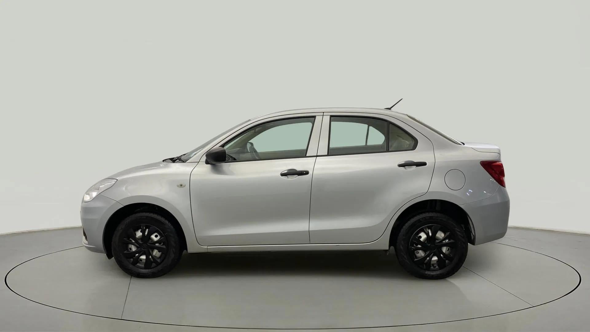 Side view of a splendid silver Maruti Suzuki Dzire 2018-2023