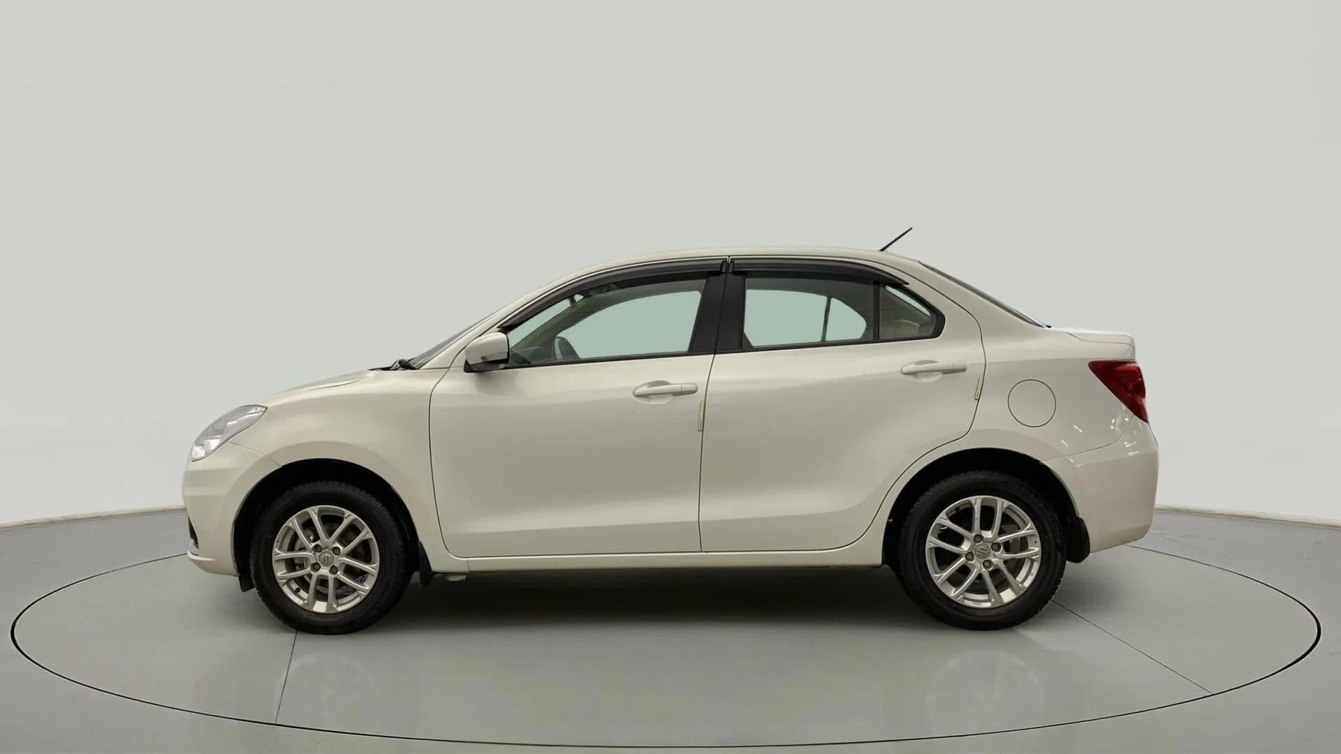 Side view of a Pearl Arctic White Maruti Suzuki Dzire