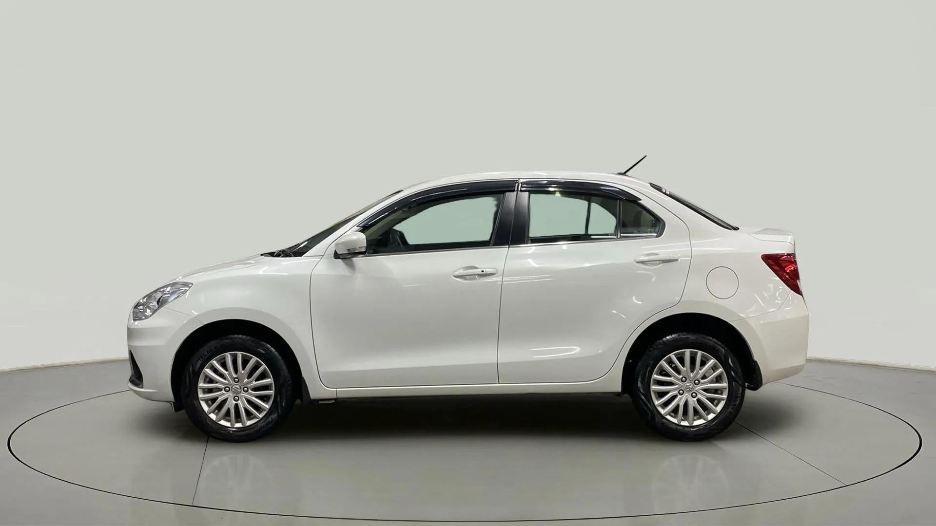 Side view of a Arctic White Maruti Suzuki Dzire 2018-2023