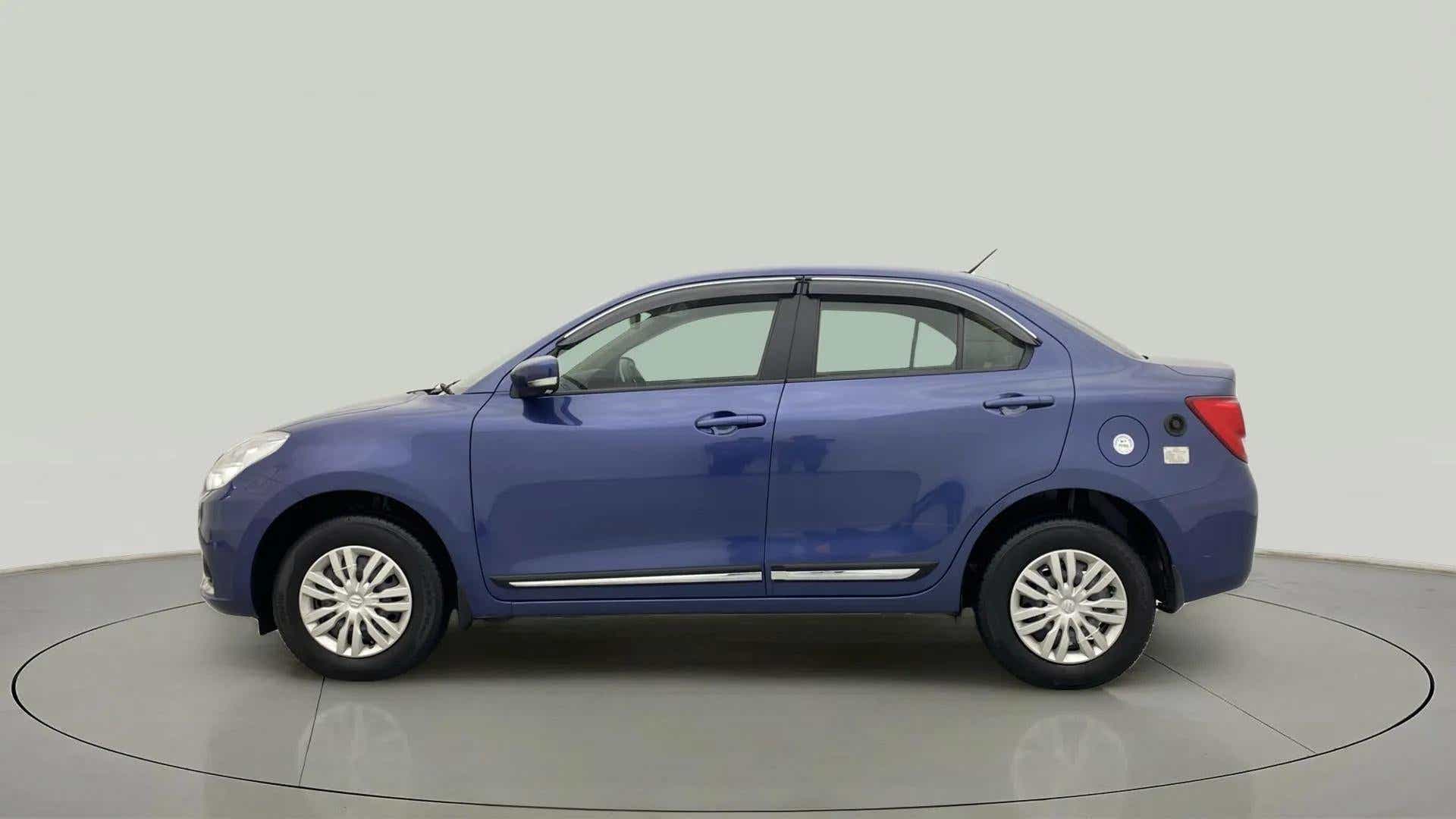 Side view of a oxford blue Maruti Suzuki Dzire 2018-2023