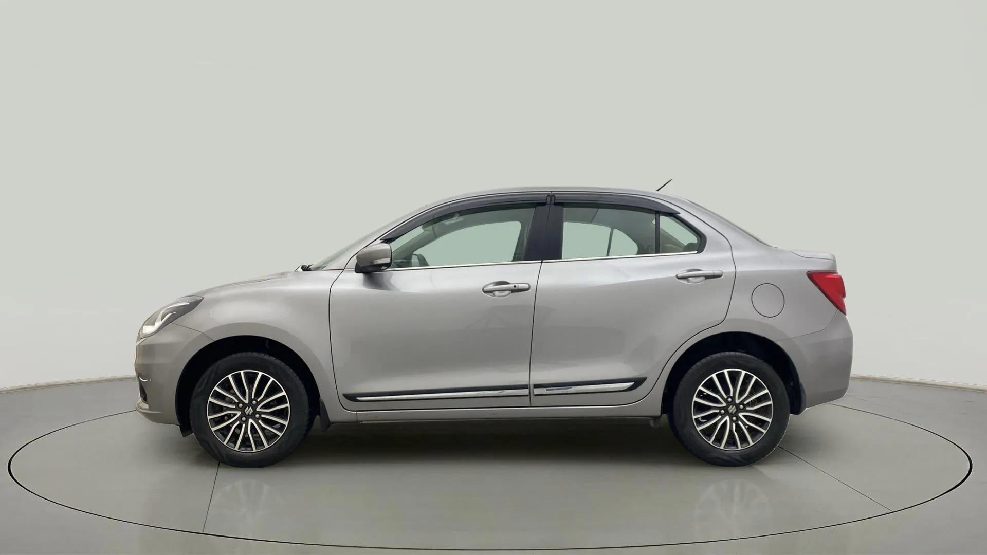 Side view of a splendid silver Maruti Suzuki Dzire 2018-2023