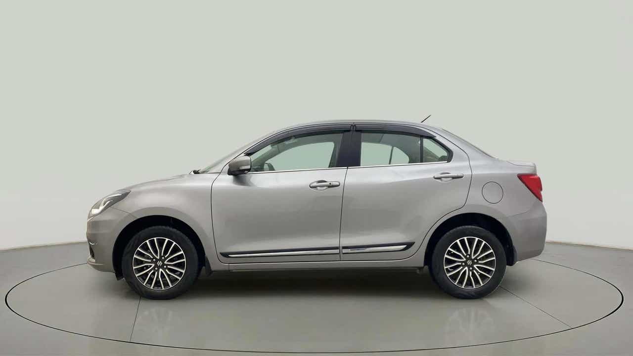 Side view of a splendid silver Maruti Suzuki Dzire 2018-2023