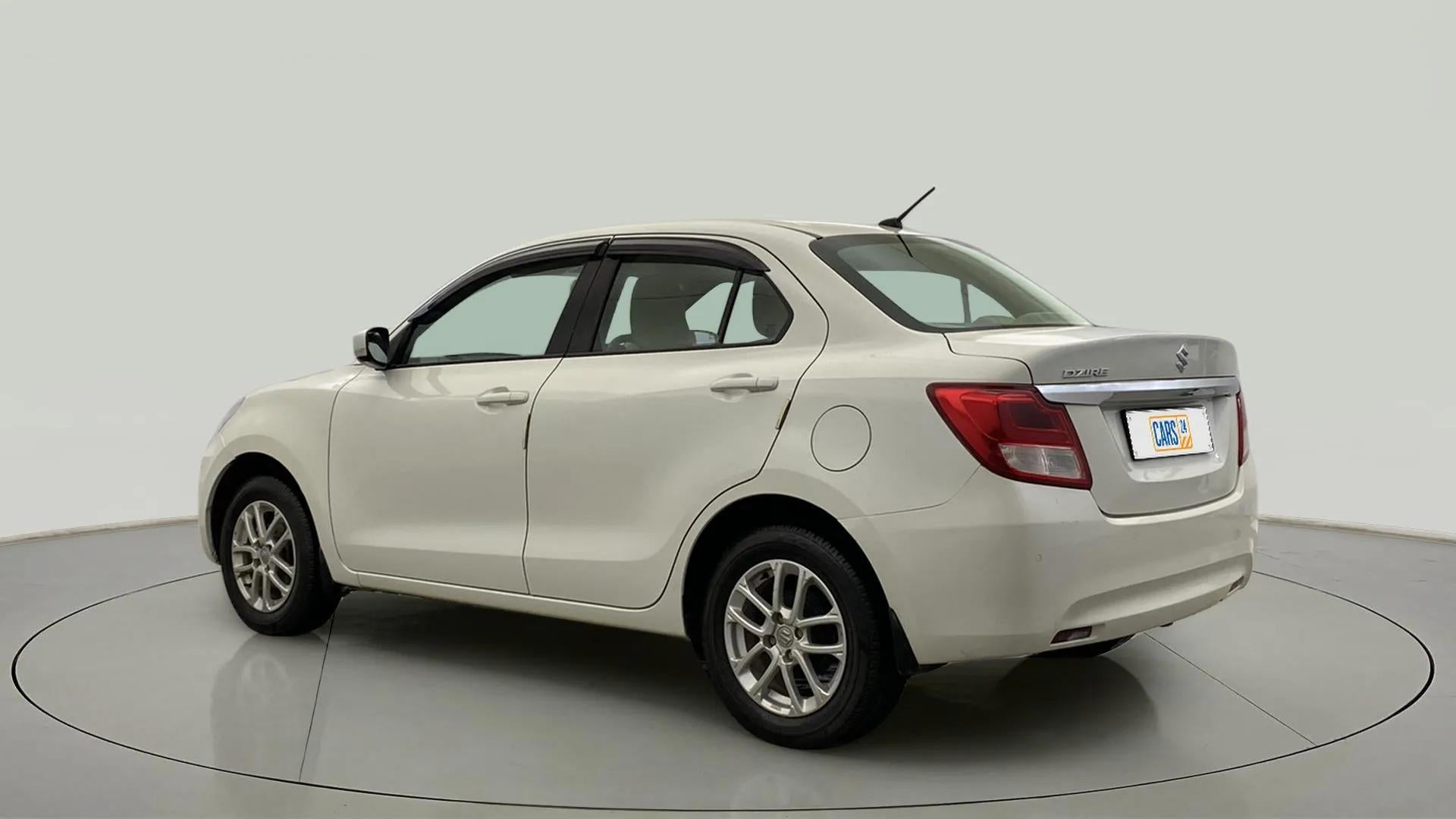 Rear three-quarter of a Maruti Suzuki Dzire
