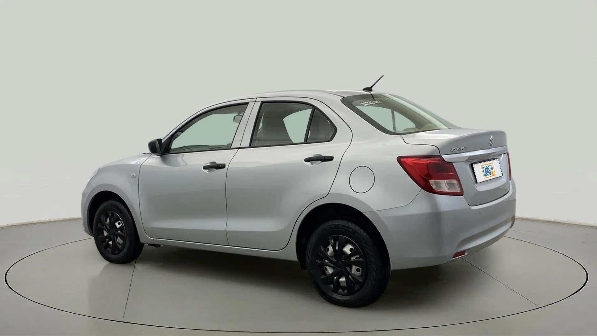 Rear three-quarter view of a splendid silver Maruti Suzuki Dzire 2018-2023