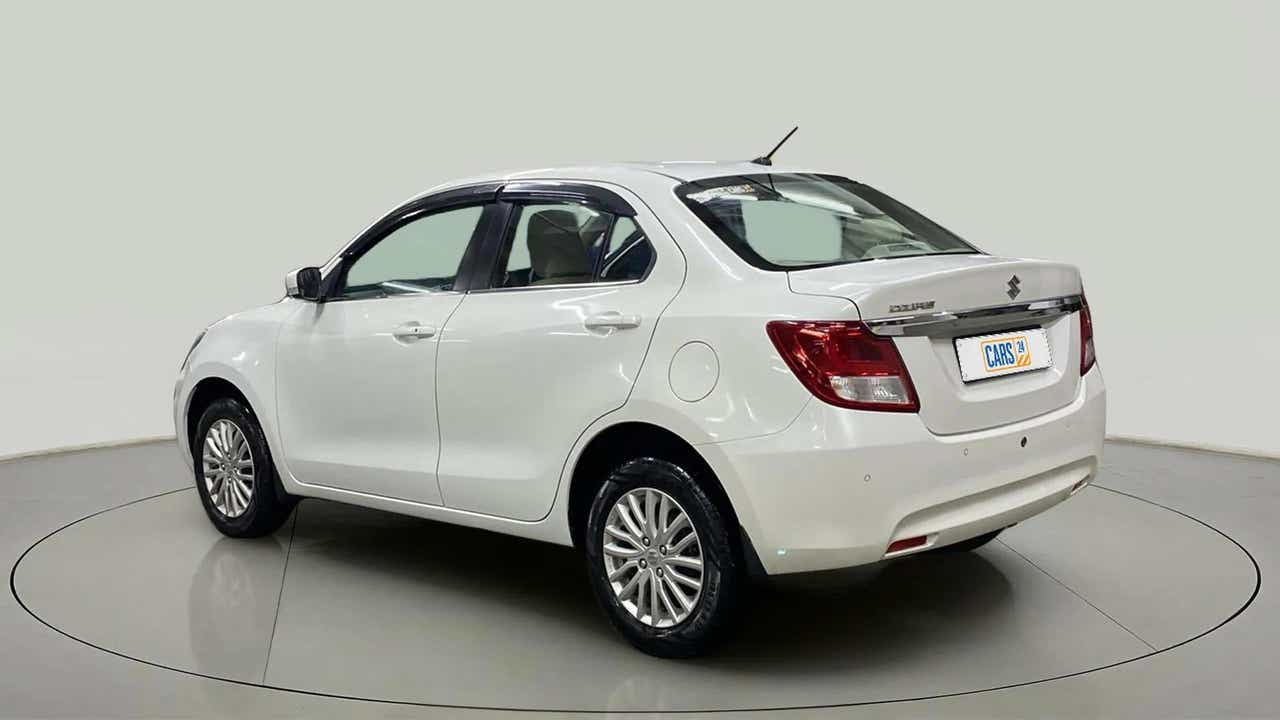Rear three-quarter of a arctic white Maruti Suzuki Dzire 2018-2023