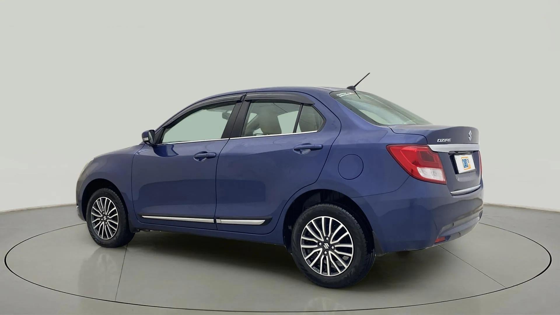 Rear three-quarter view of a Alluring Blue Maruti Suzuki Dzire