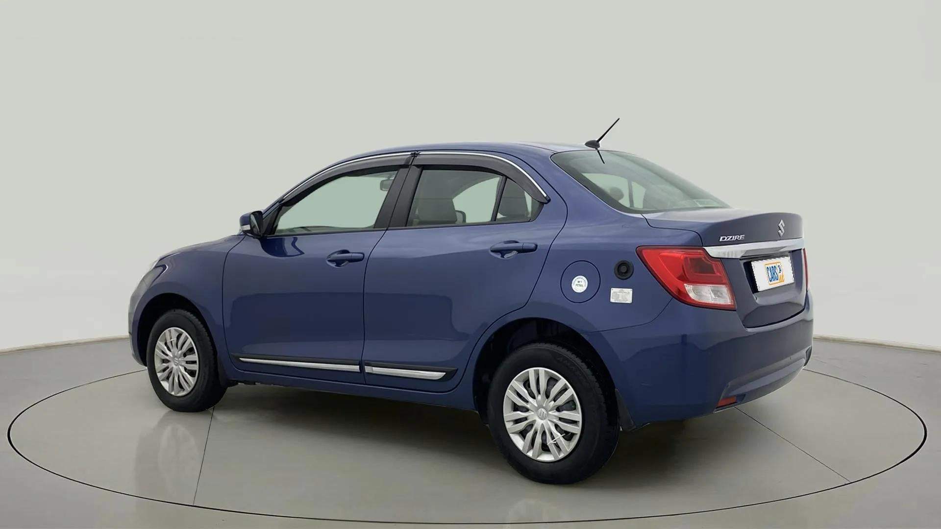 Rear three-quarter of a Maruti Suzuki Dzire 2018-2023