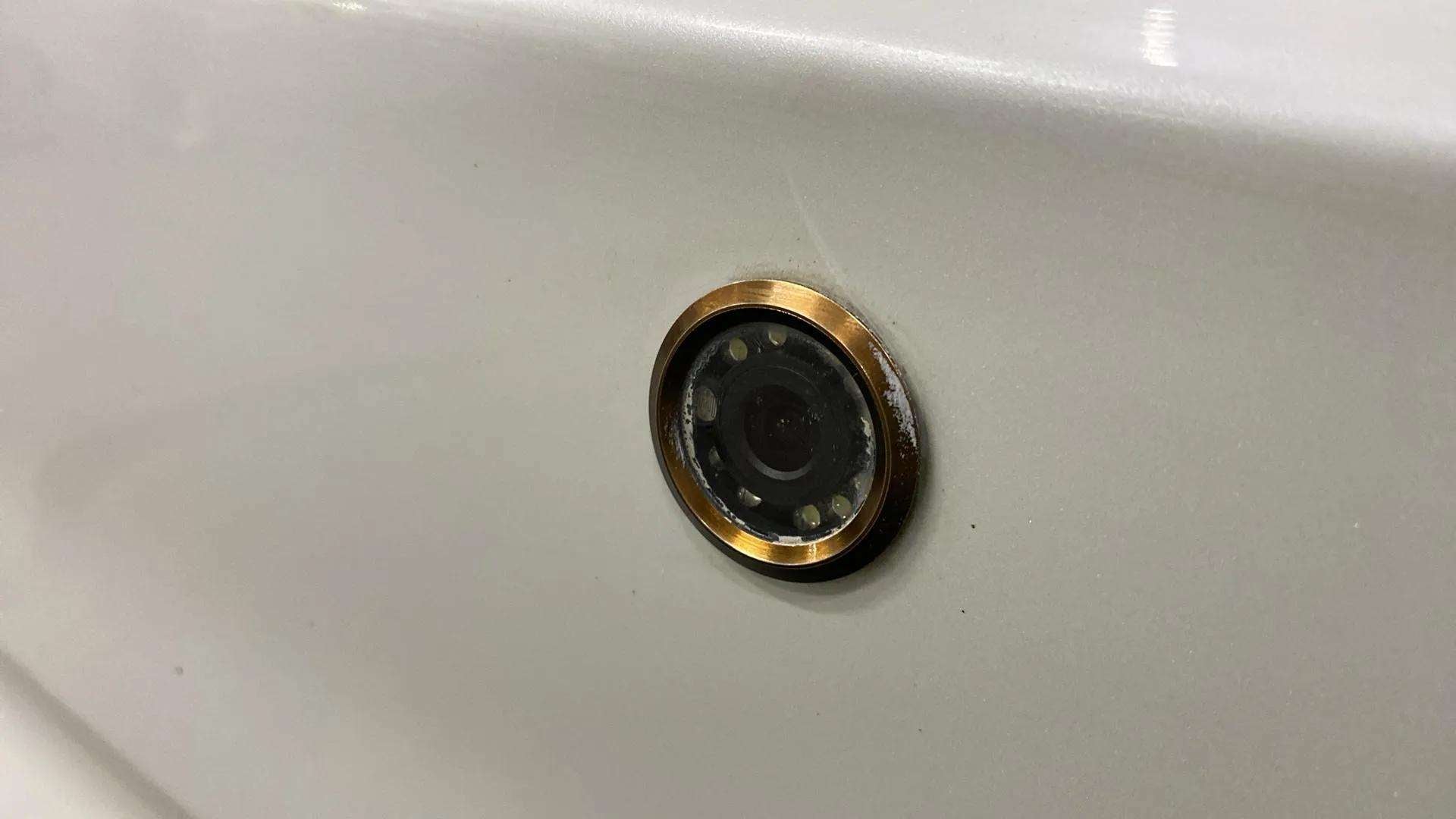 Close-up of a rear camera on a Maruti Suzuki Dzire 2018-2023