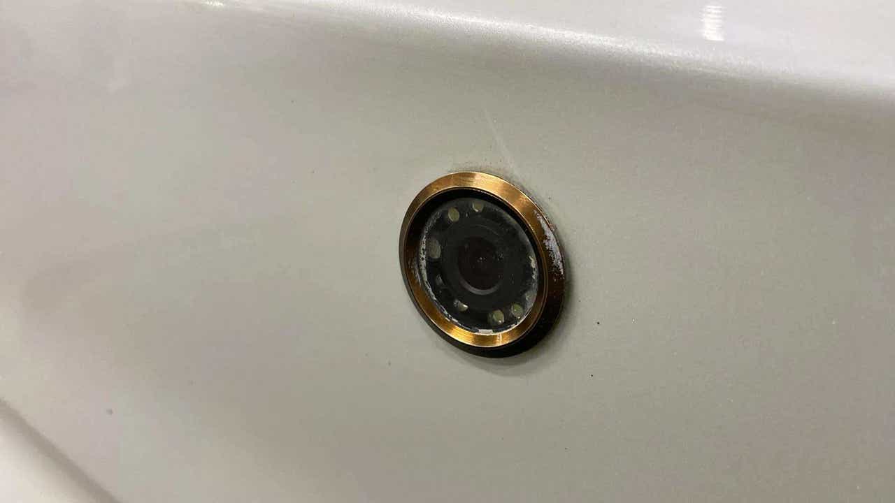 Close-up of a rear camera on a Maruti Suzuki Dzire 2018-2023