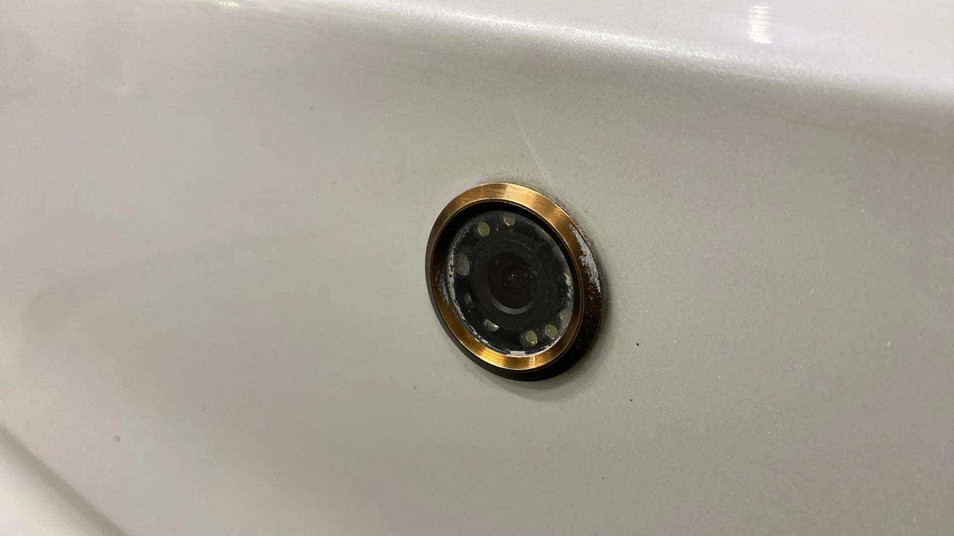 Close-up of a rear camera on a Maruti Suzuki Dzire 2018-2023