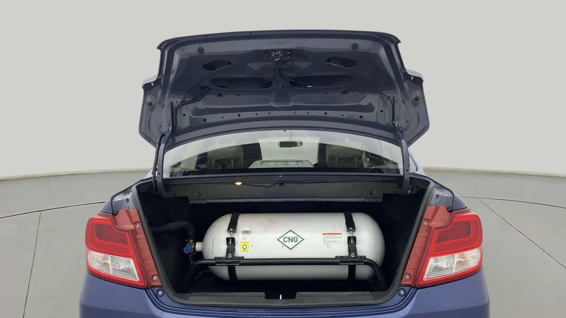Open trunk view of a Maruti Suzuki Dzire 2018-2023 with visible CNG cylinder