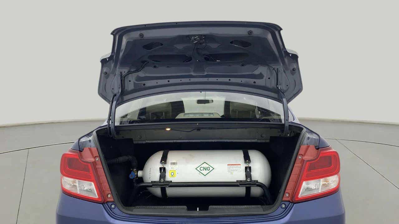 Open trunk view of a Maruti Suzuki Dzire 2018-2023 with visible CNG cylinder
