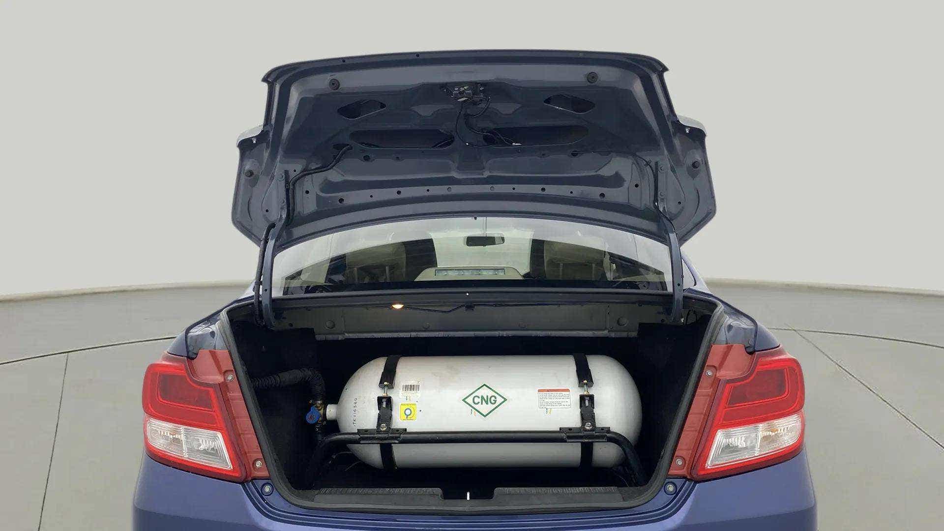 Open trunk view of a Maruti Suzuki Dzire 2018-2023 with visible CNG cylinder