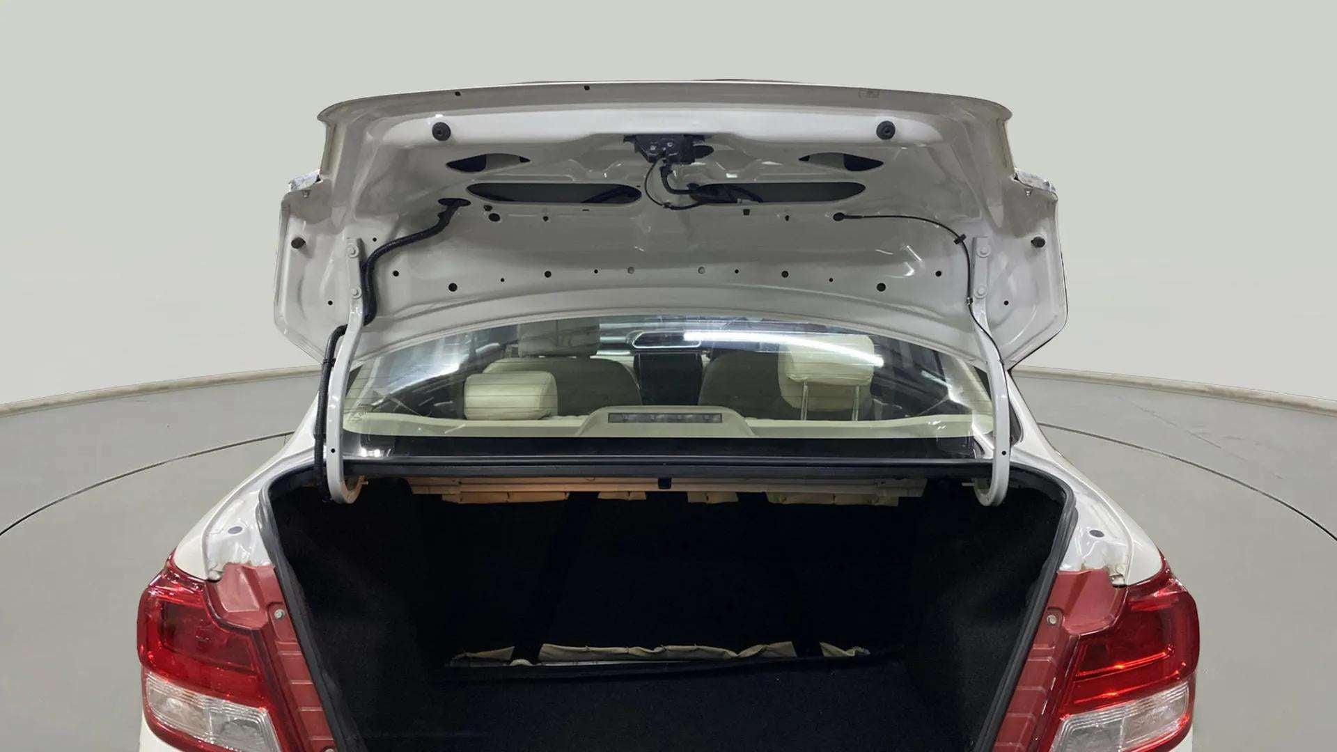 Open boot view of a arctic white Maruti Suzuki Dzire 2018-2023