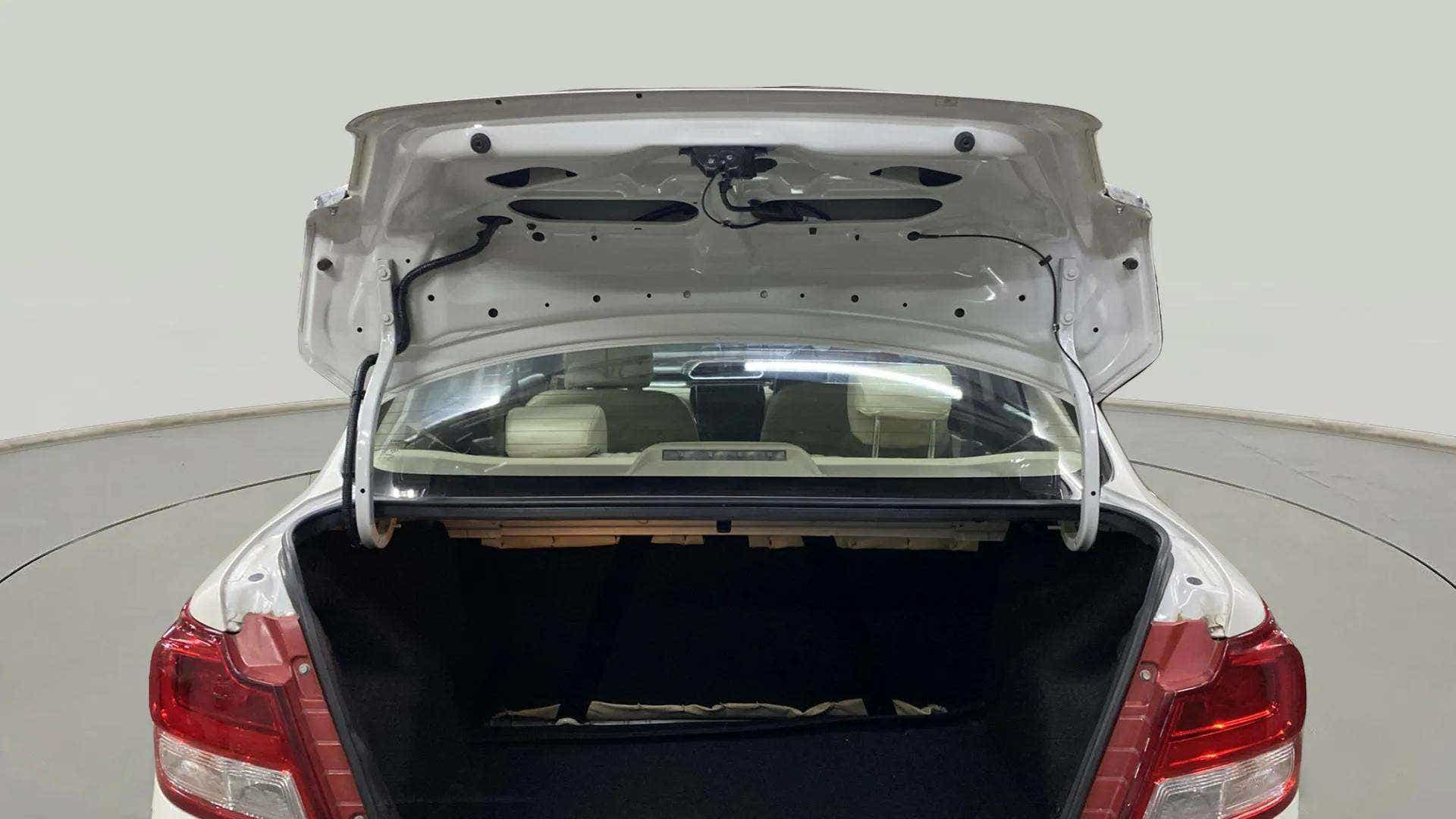 Open boot view of a arctic white Maruti Suzuki Dzire 2018-2023