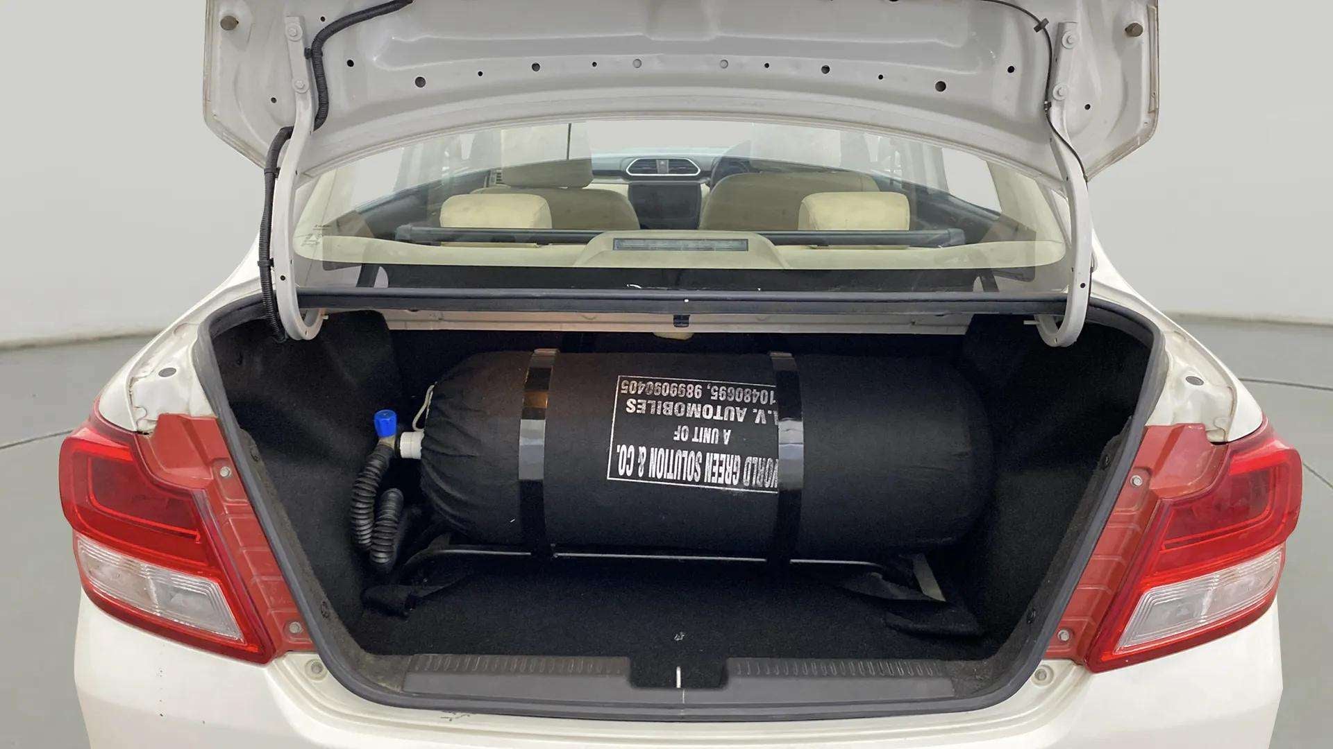 Cng cylinder in the trunk of a Maruti Suzuki Dzire