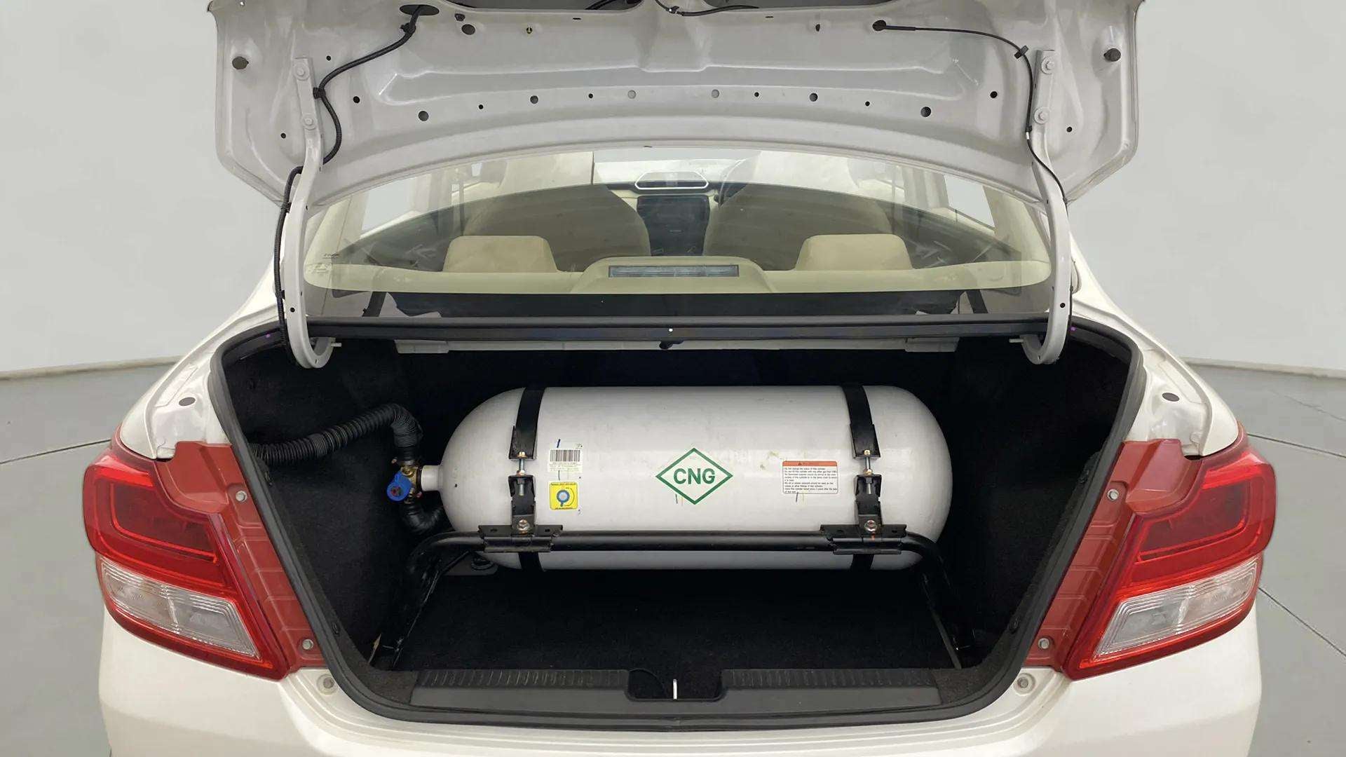 Cng cylinder in the trunk of a Maruti Suzuki Dzire