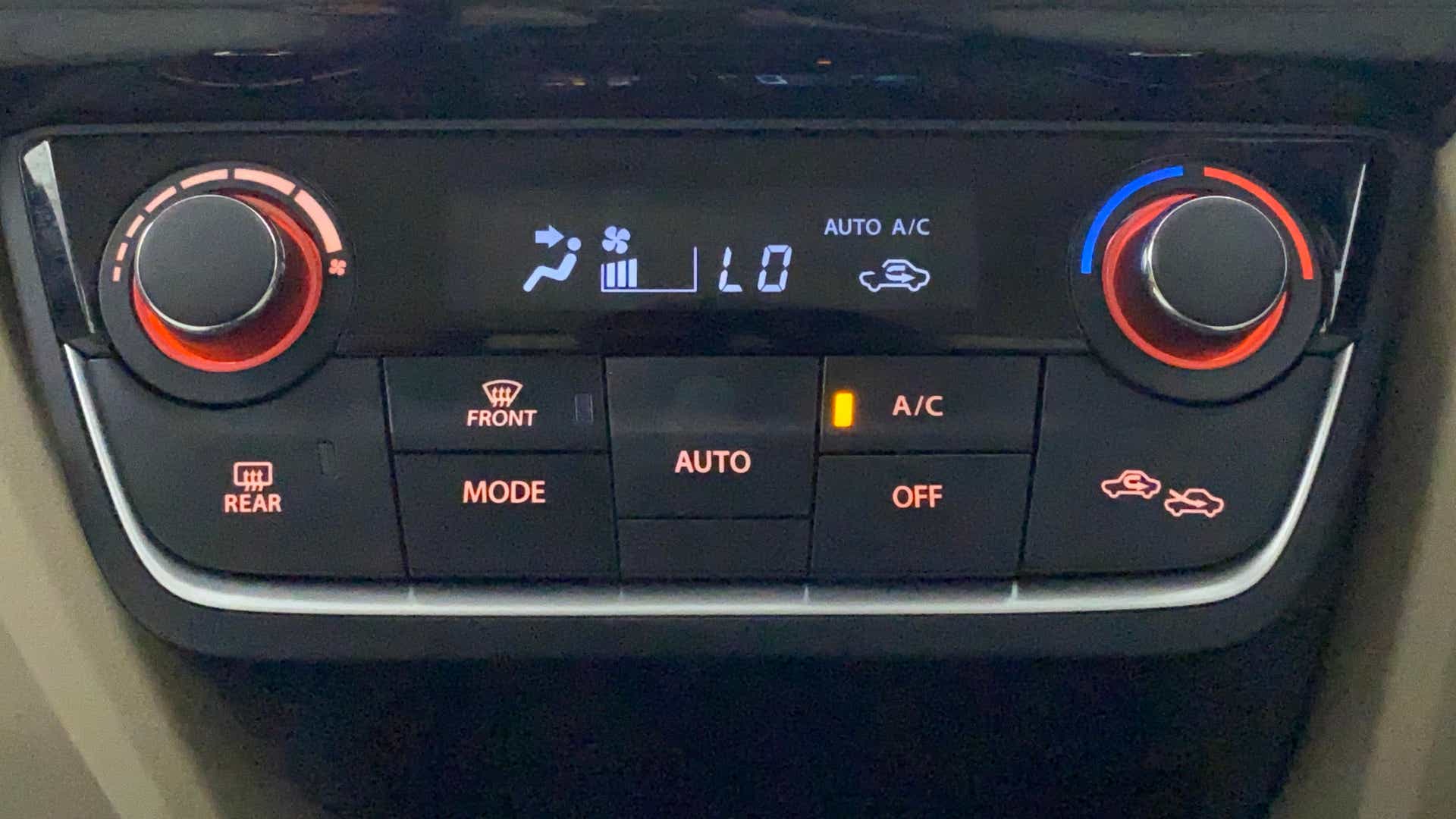 Dashboard air conditioning controls of a Maruti Suzuki Dzire 2018-2023