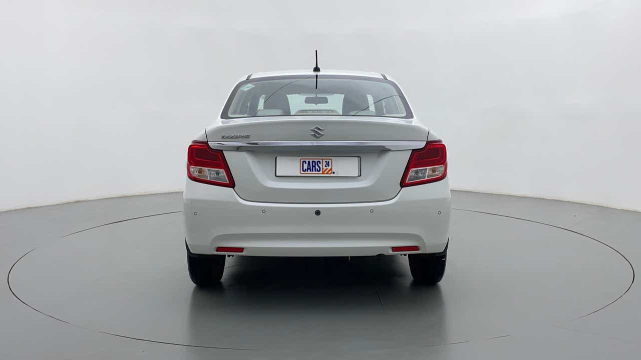 Rear view of a arctic white Maruti Suzuki Dzire 2018-2023