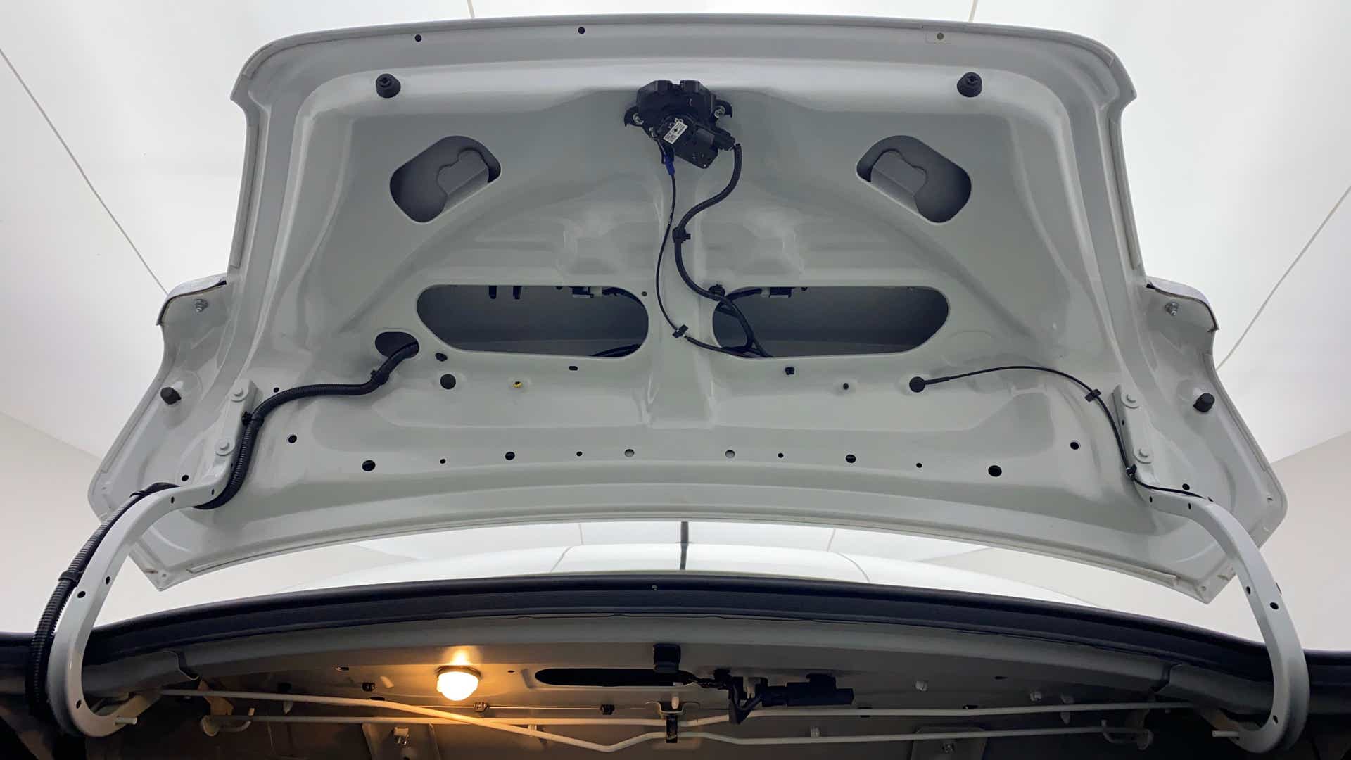 Boot lid interior view of a arctic white Maruti Suzuki Dzire 2018-2023
