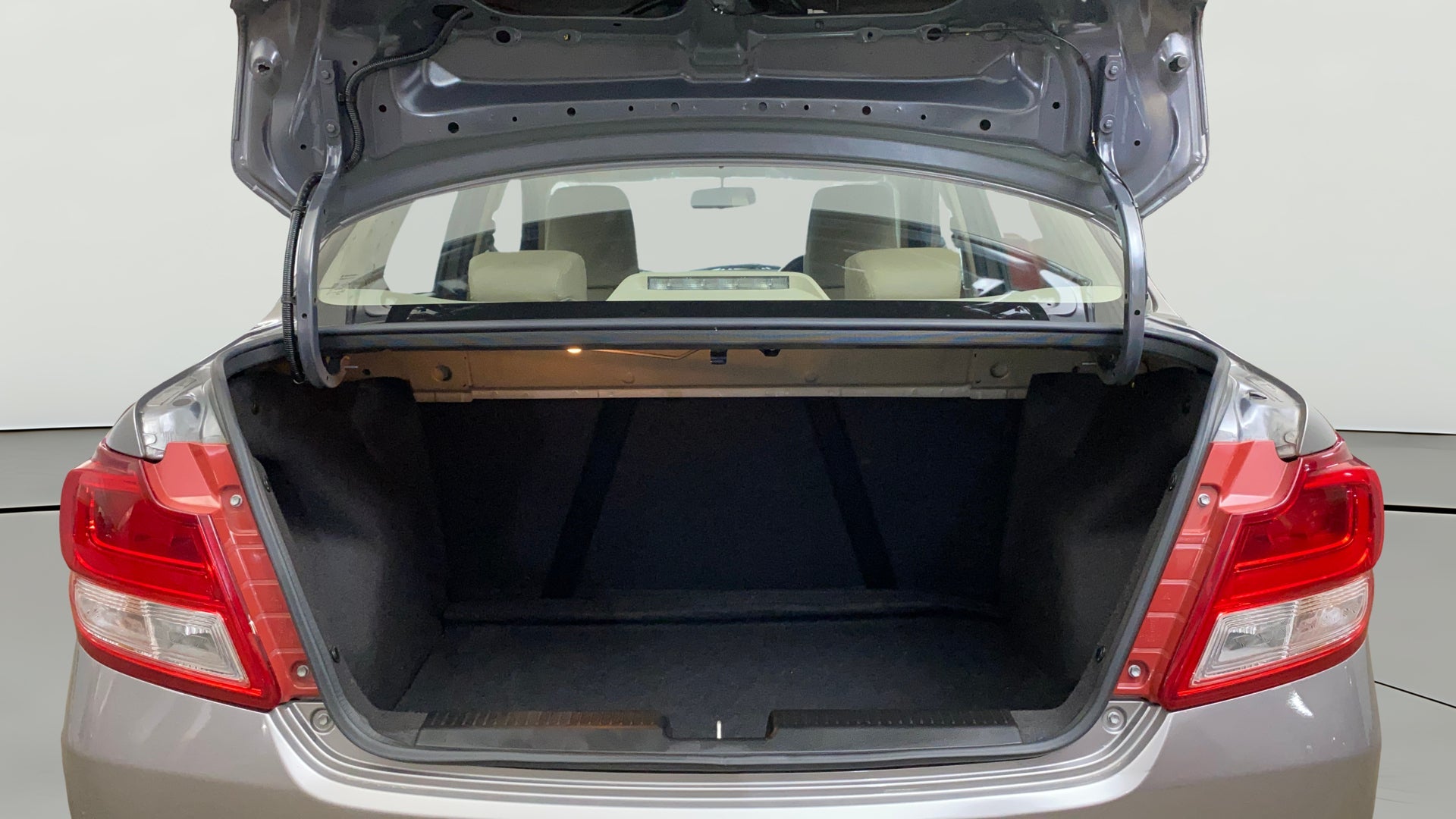 Open trunk view of a Maruti Suzuki Dzire 2018-2023