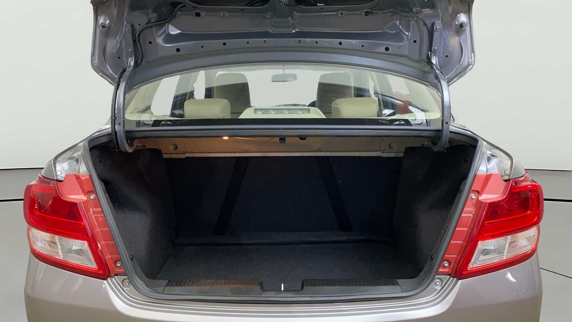 Open trunk view of a Maruti Suzuki Dzire 2018-2023